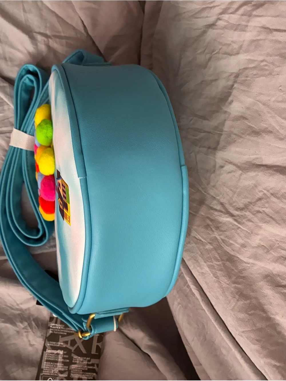Loungefly Turquoise Round Crossbody with Multicolor Pom-Poms